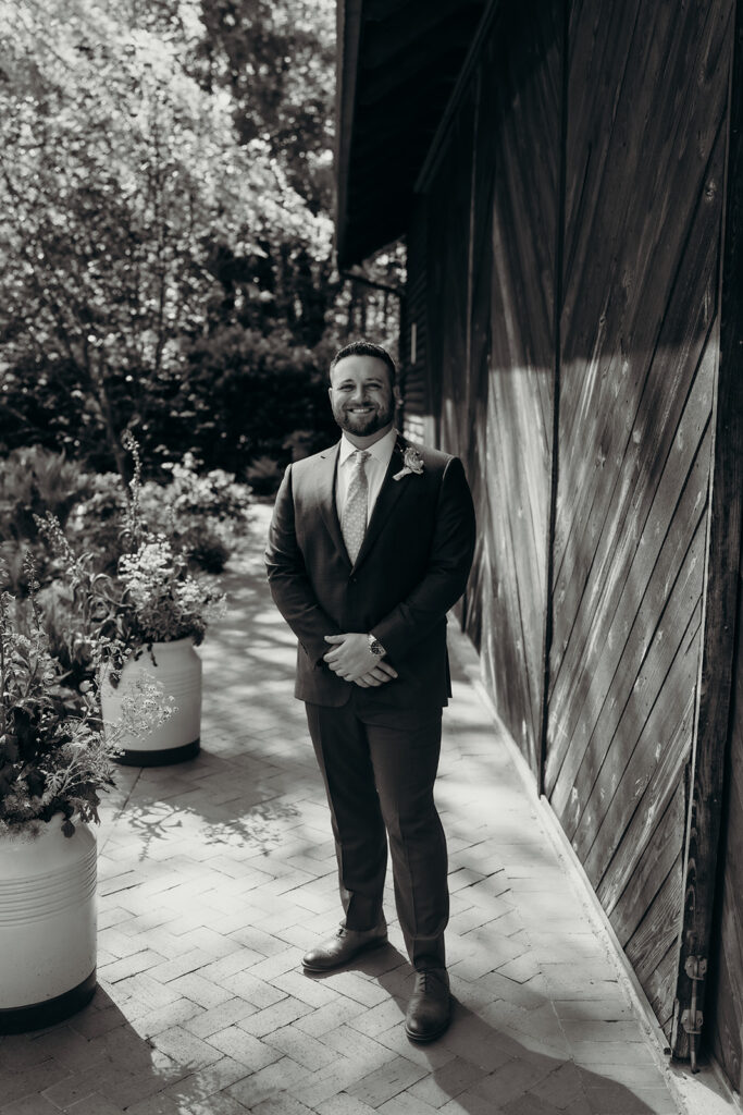 groom getting ready by the barn