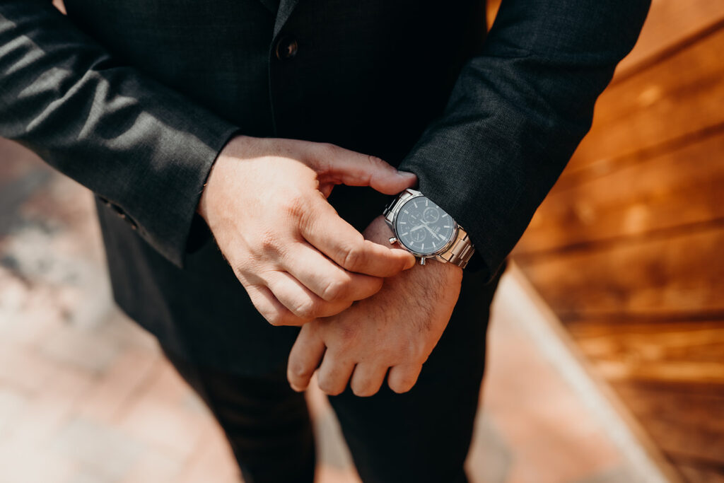 groom getting ready by the barn