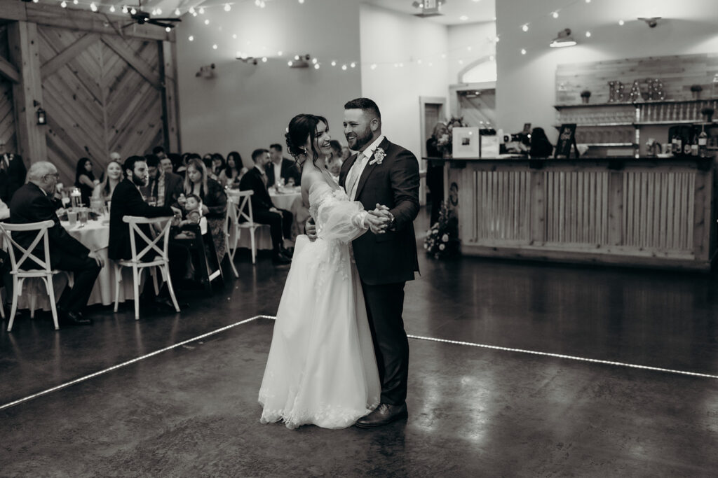 couple fist dance in the barn