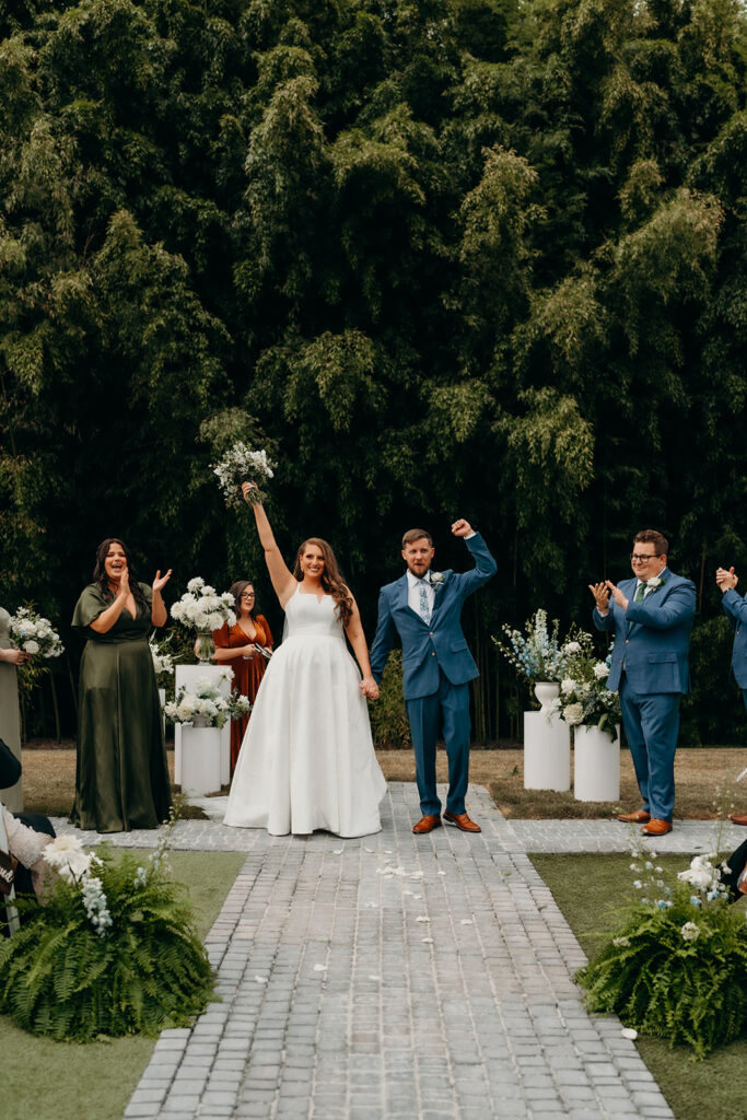 Couple celebrating after their first kiss during the ceremony