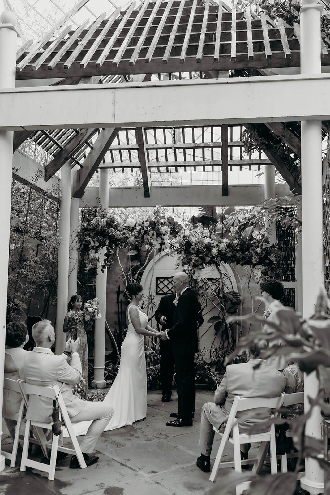 bride and groom standing by altar