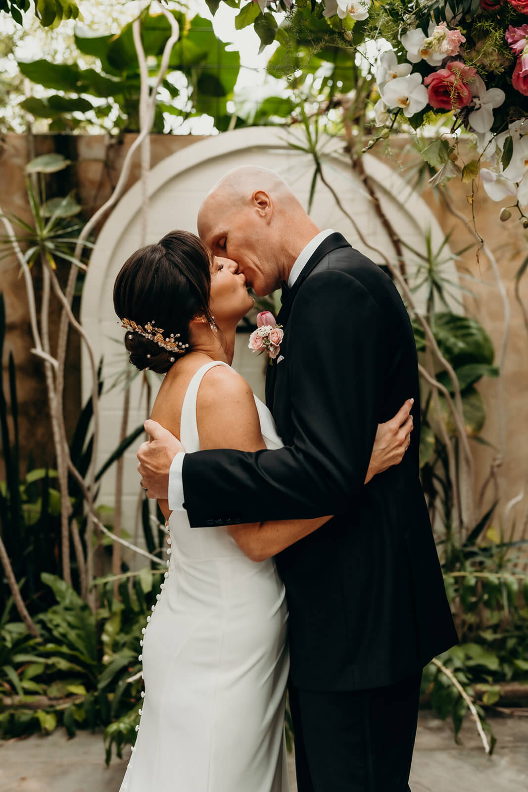 bride and groom first kiss at ceremony