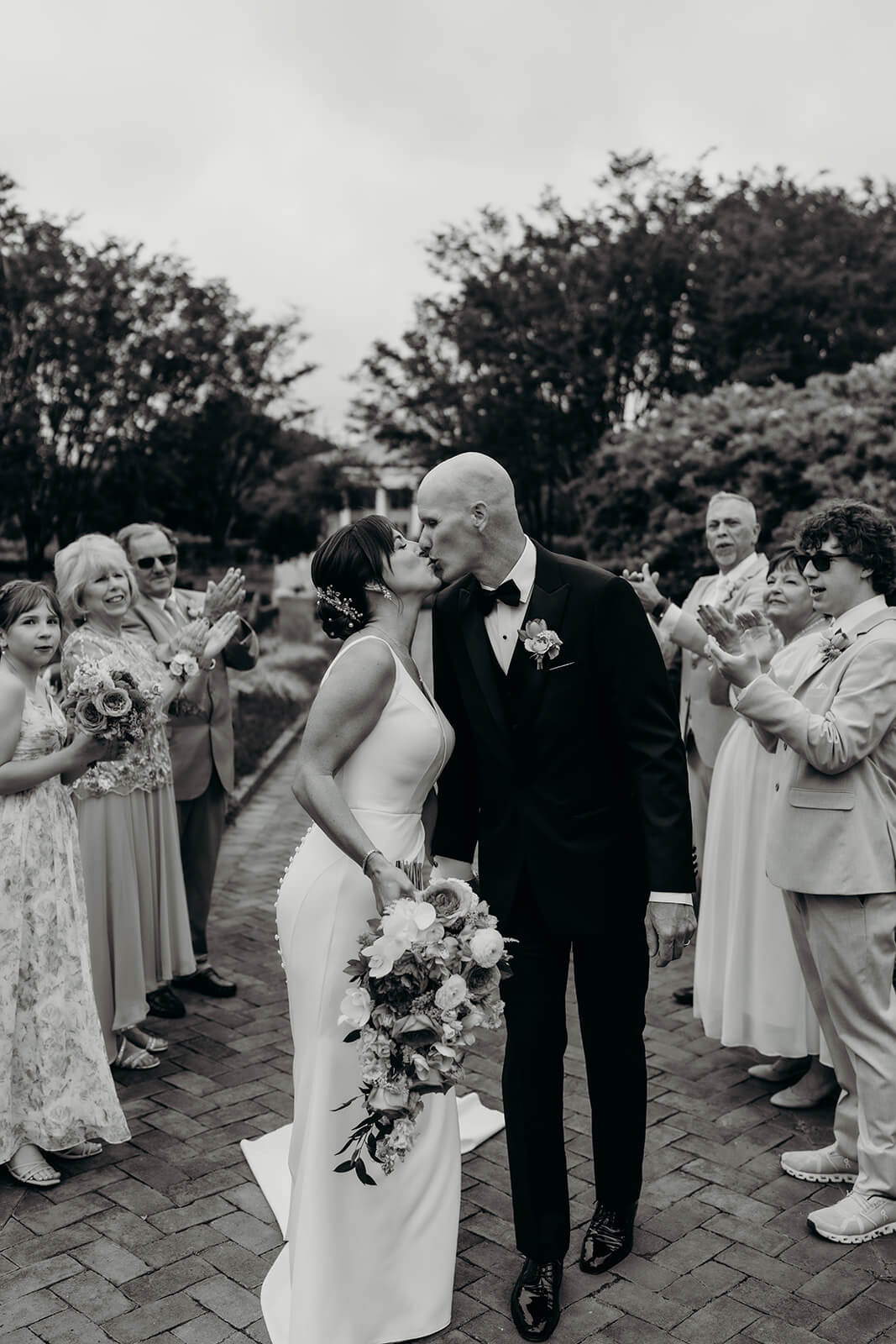 bride and groom celebrating with family for a Daniel Stowe Botanical Garden Wedding