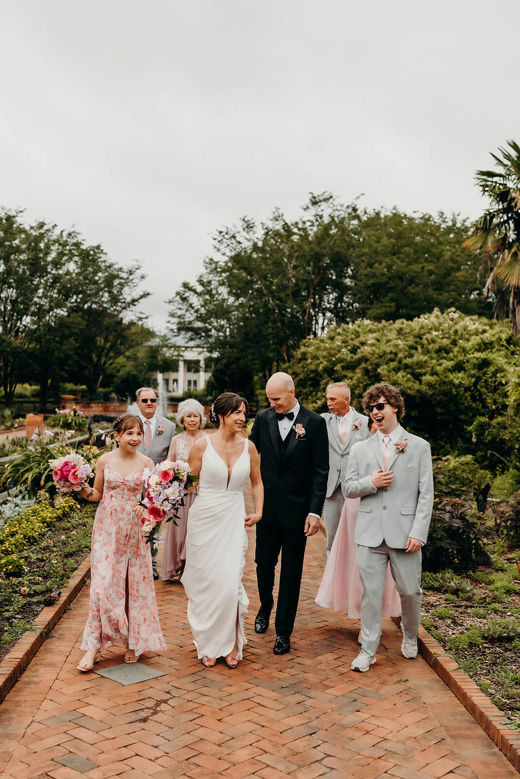 bride and groom celebrating with family for a Daniel Stowe Botanical Garden Wedding