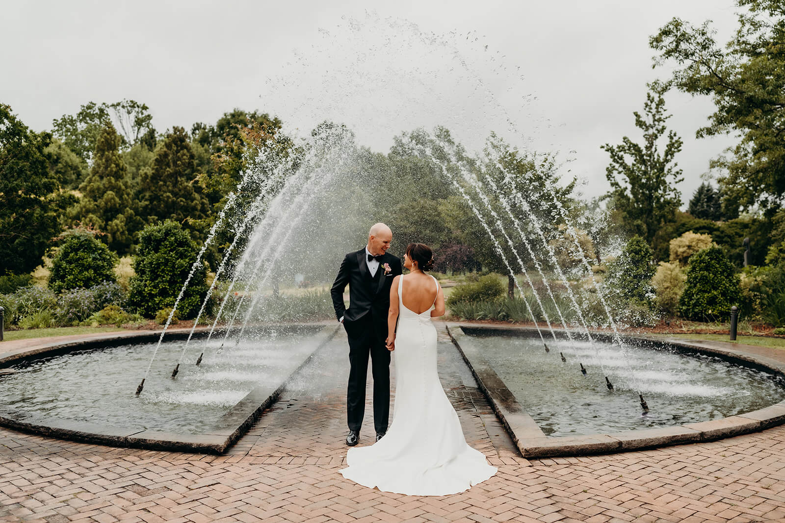 bride and groom couple's portraits bride and groom celebrating with family for a Daniel Stowe Botanical Garden Wedding
