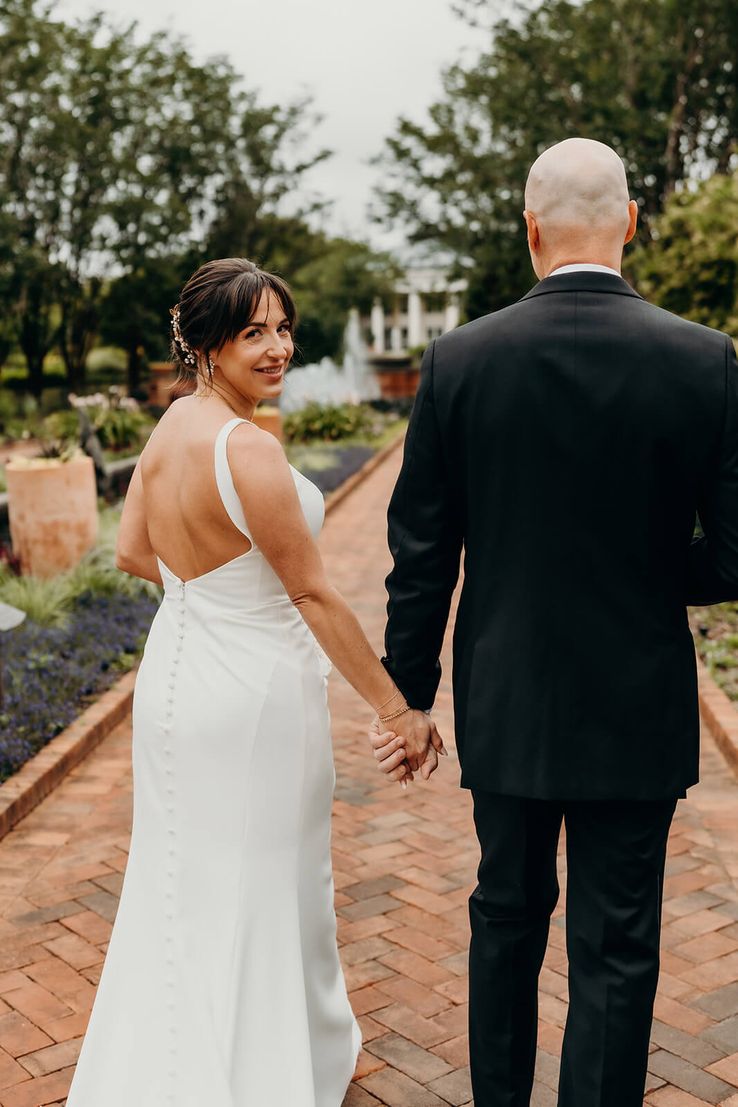 bride and groom couple's portraits bride and groom celebrating with family for a Daniel Stowe Botanical Garden Wedding