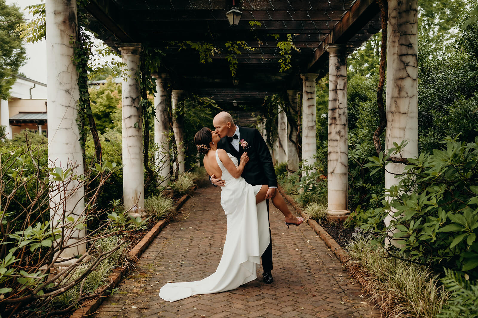 bride and groom couple's portraits bride and groom celebrating with family for a Daniel Stowe Botanical Garden Wedding
