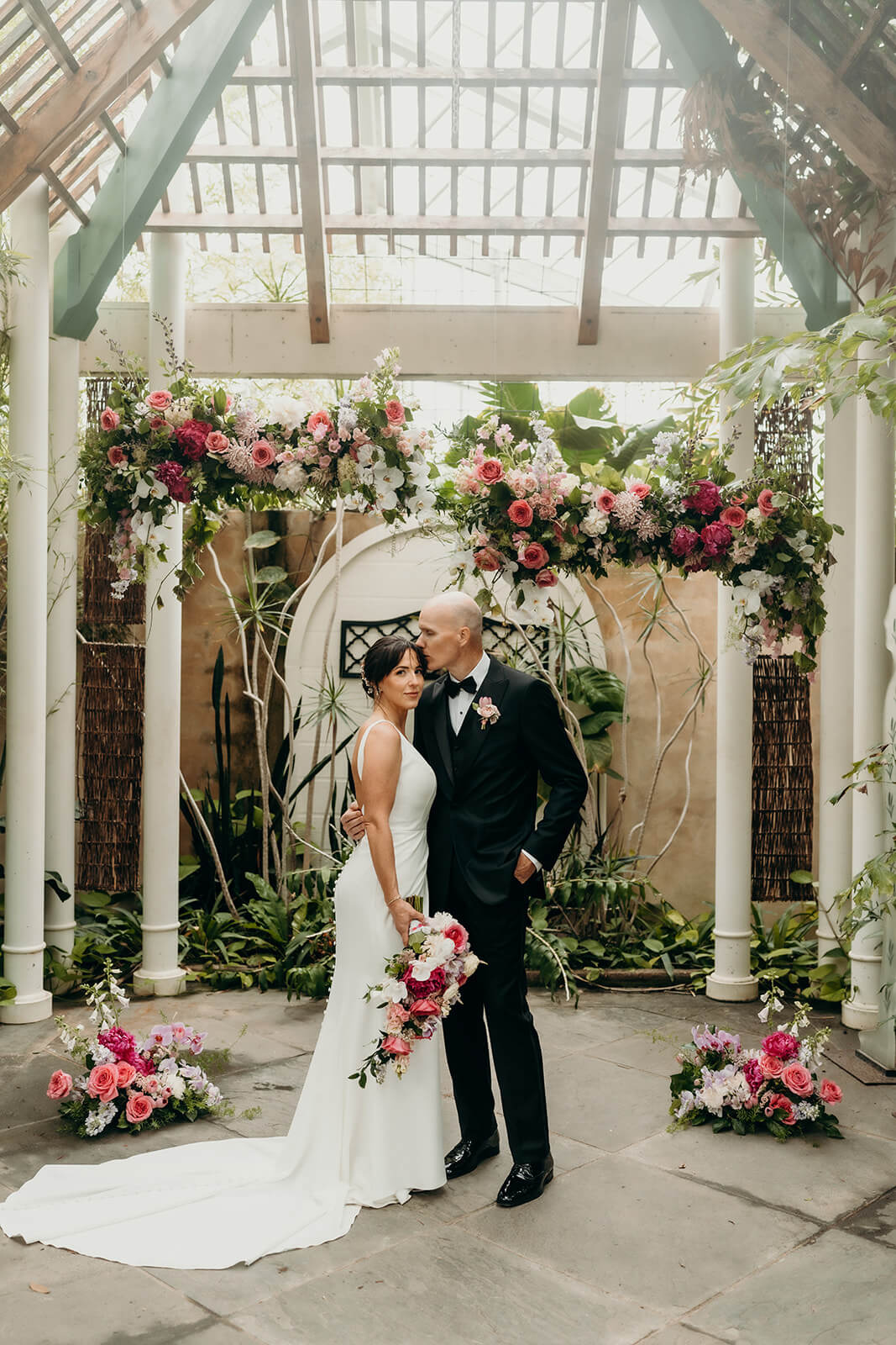 bride and groom couple's portraits bride and groom celebrating with family for a Daniel Stowe Botanical Garden Wedding