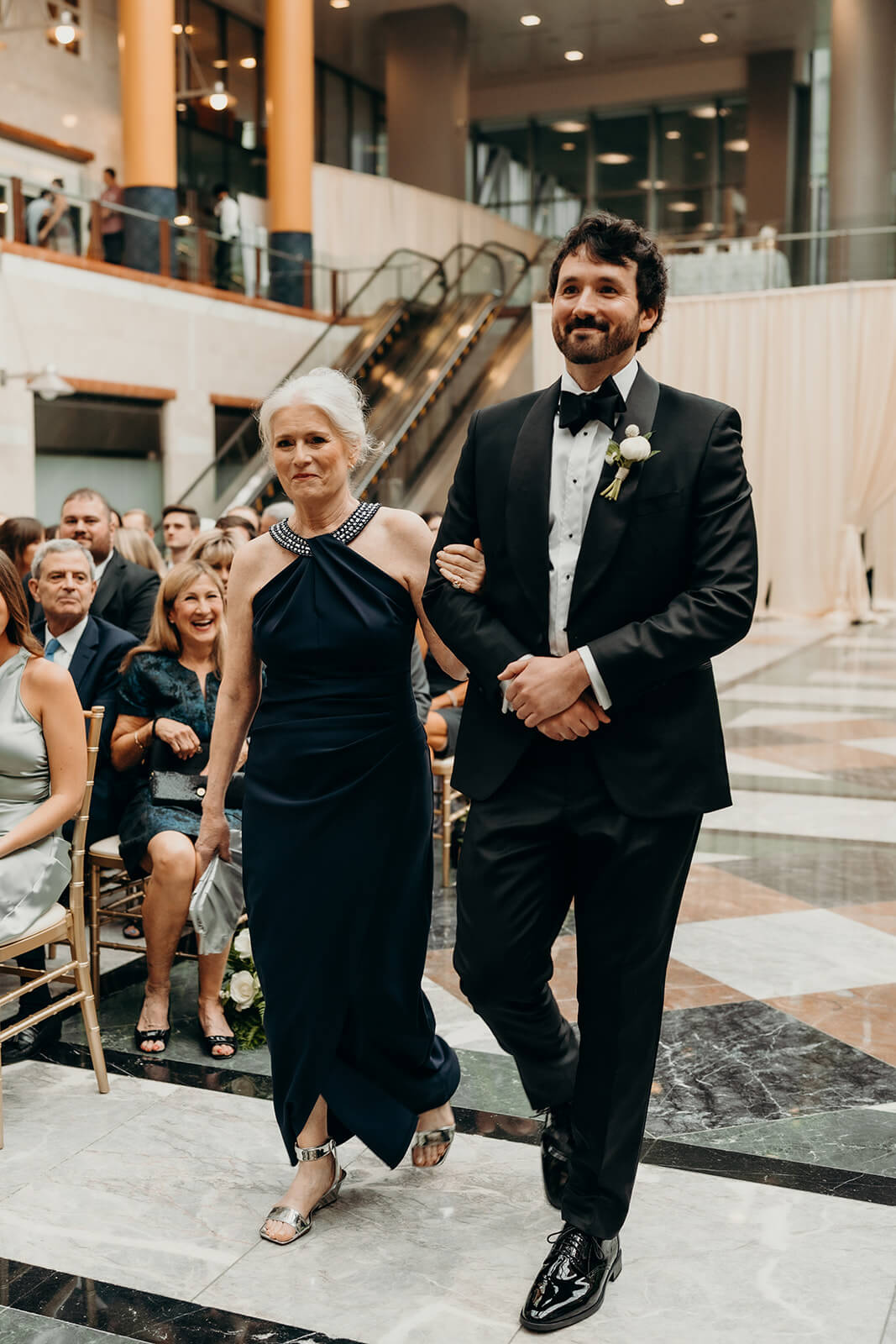 groom walking down aisle at Founders Hall Charlotte