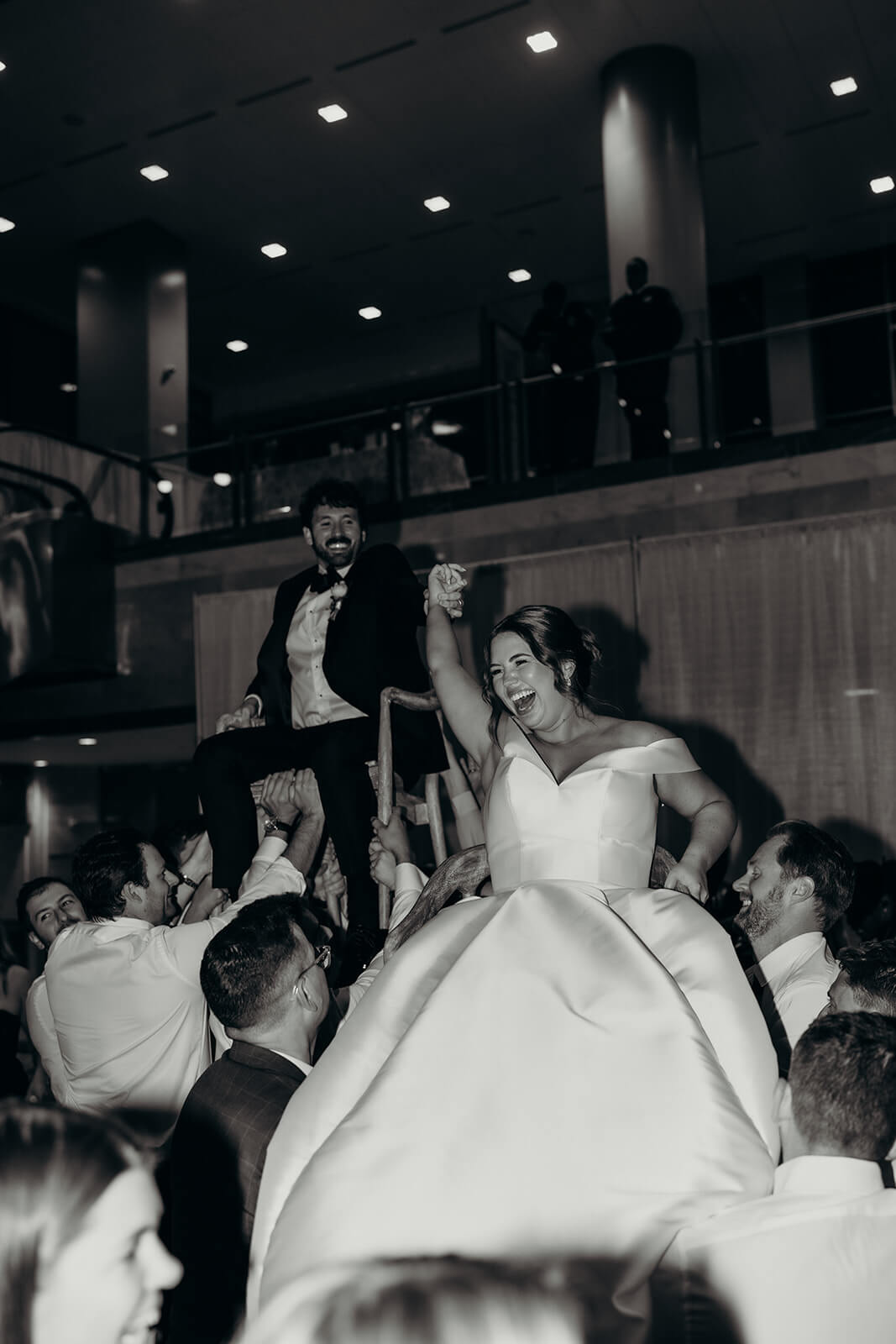 bride being held up in the air on the dance floor at Founders Hall Charlotte