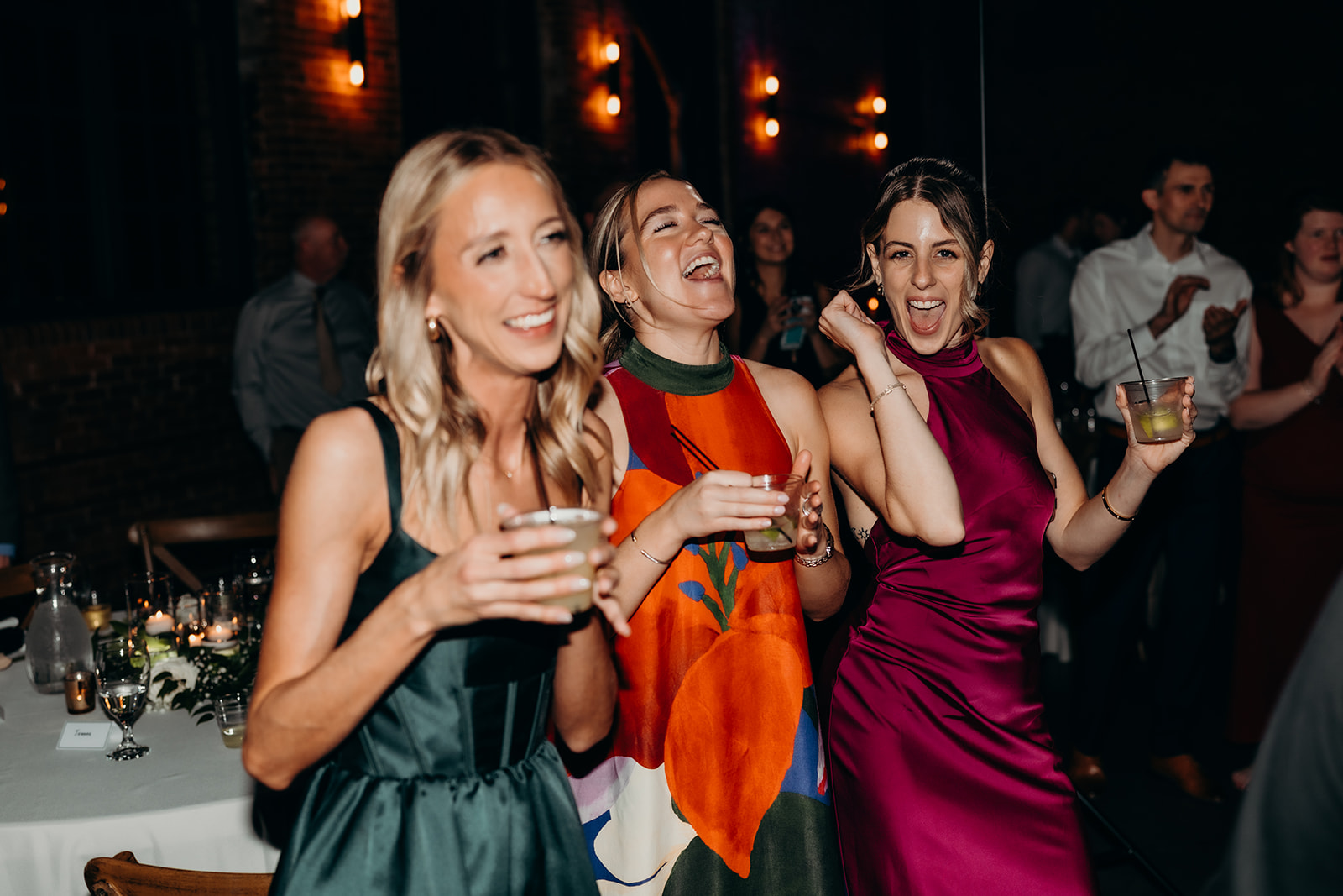 guests cheering during cake cutting