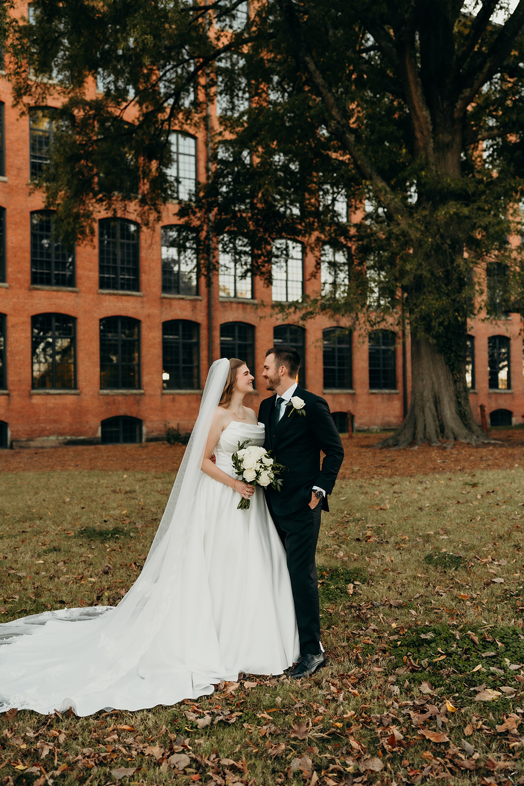 couple's portraits at Loray Mill event hall
