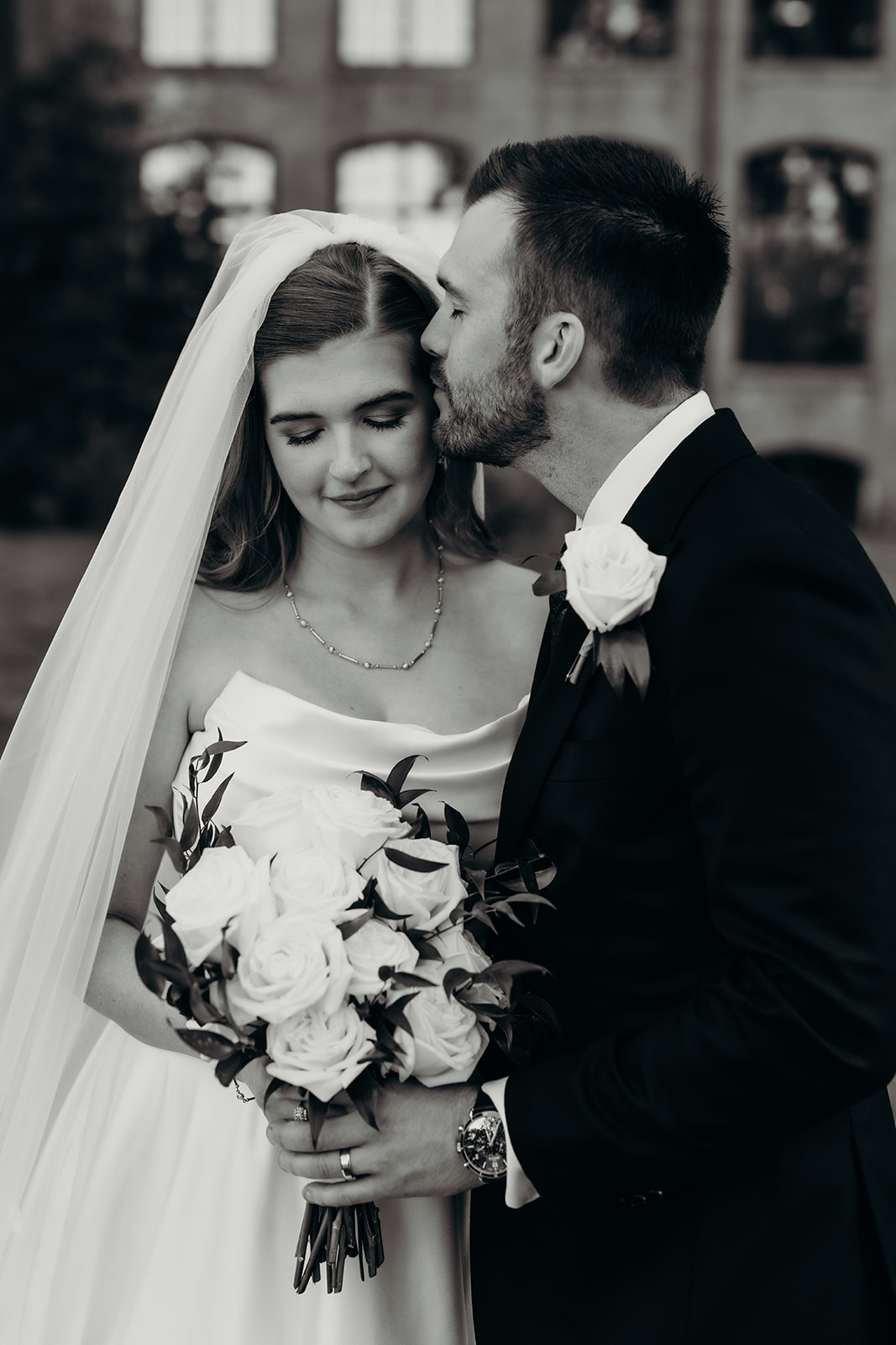 couple's portraits at Loray Mill event hall