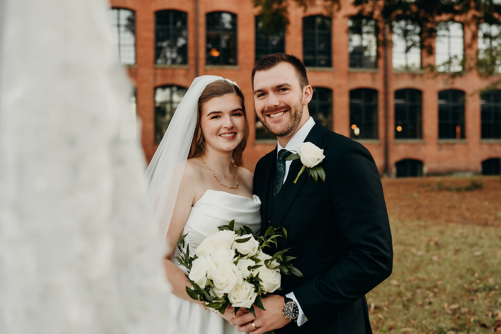 couple's portraits at Loray Mill event hall