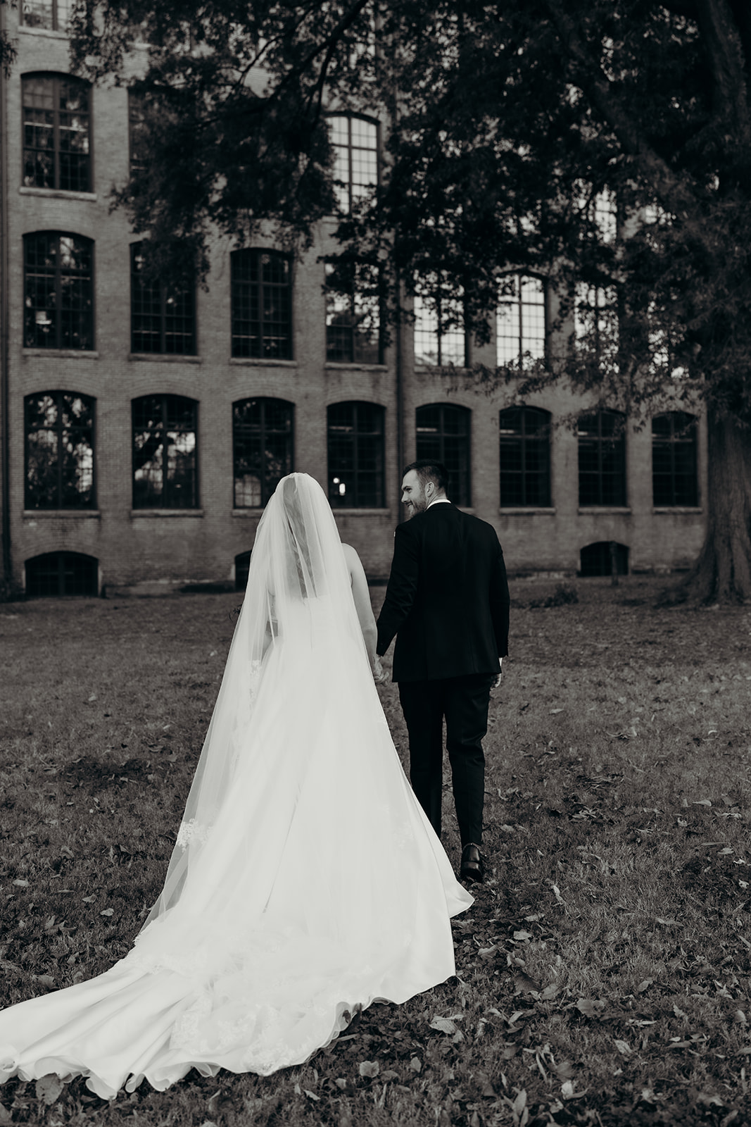 couple's portraits at Loray Mill event hall
