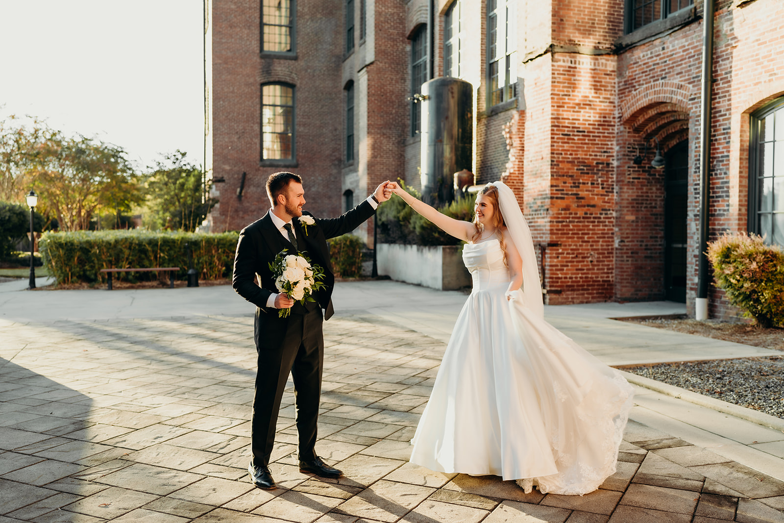 couple's portraits at Loray Mill event hall