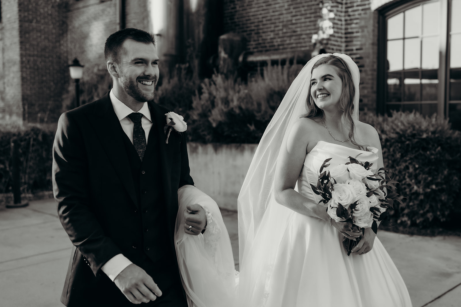 couple's portraits at Loray Mill event hall