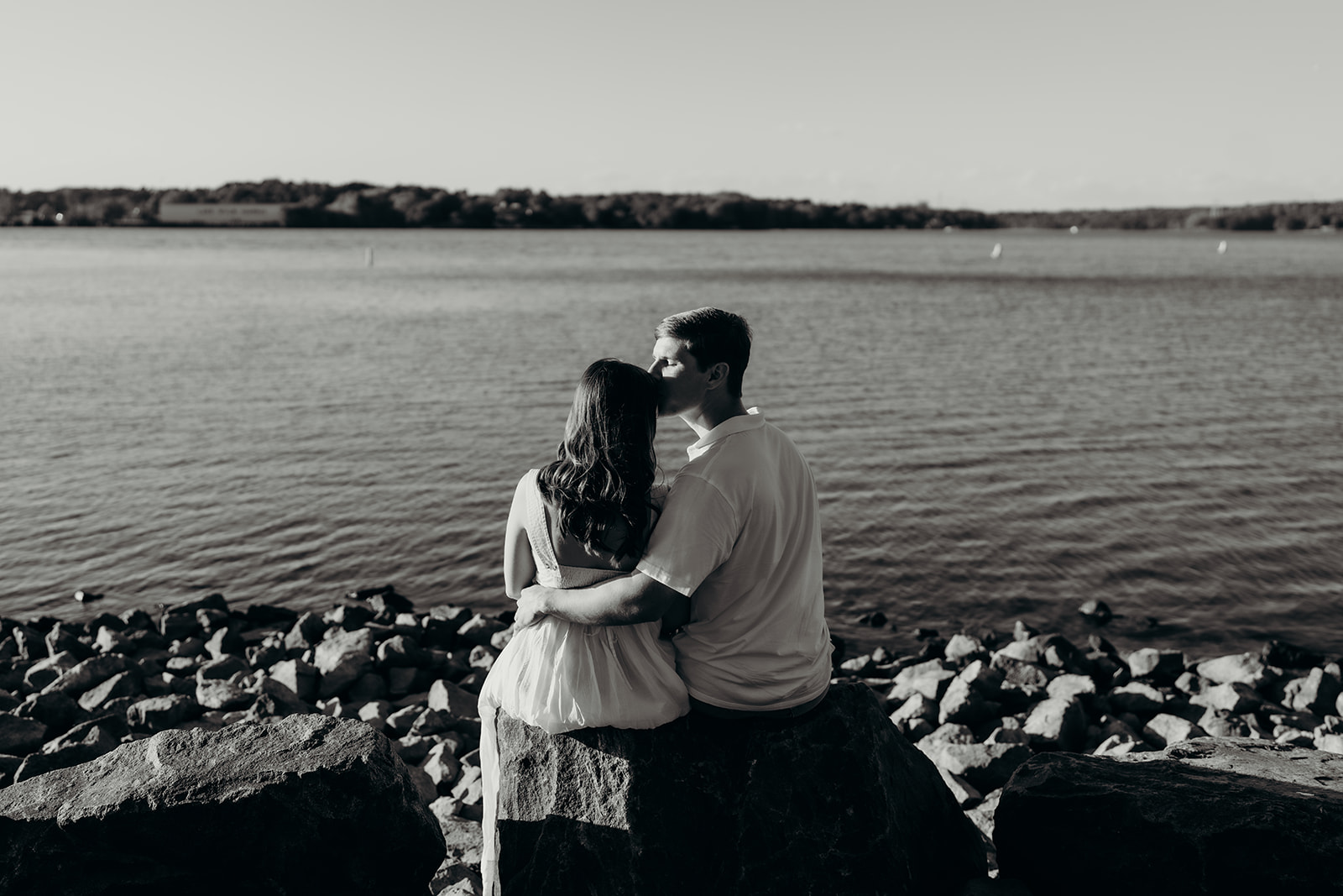 Couple on rocks by the lake