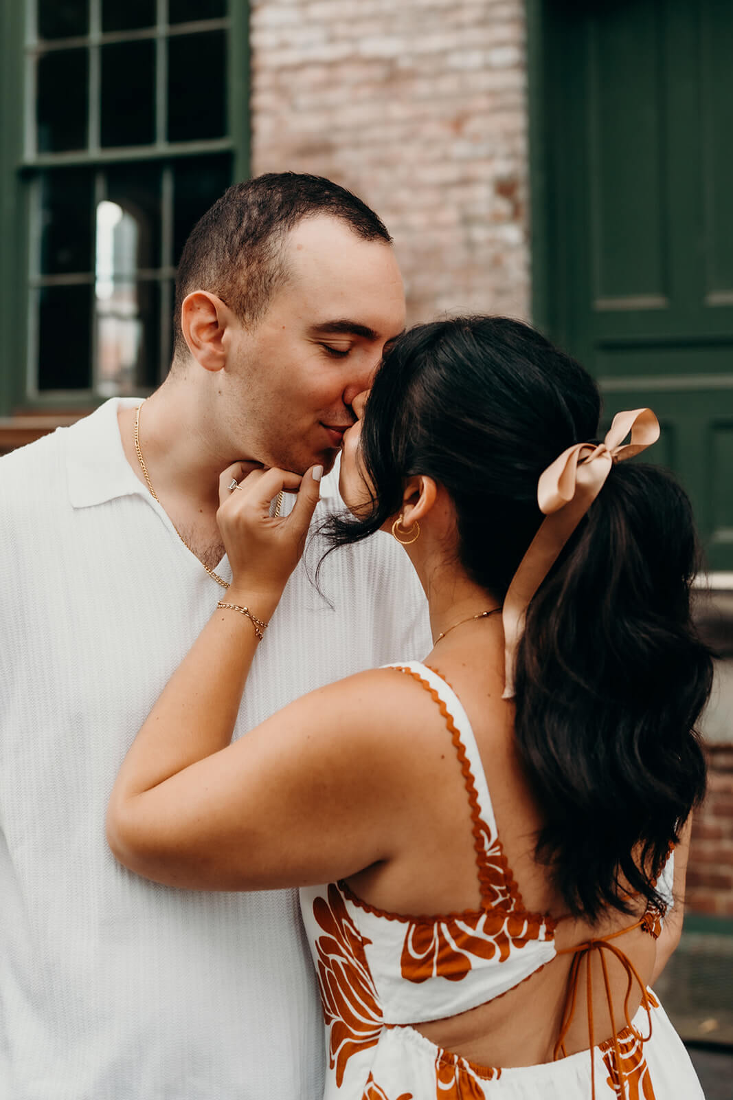 Couple leaning in for a kiss