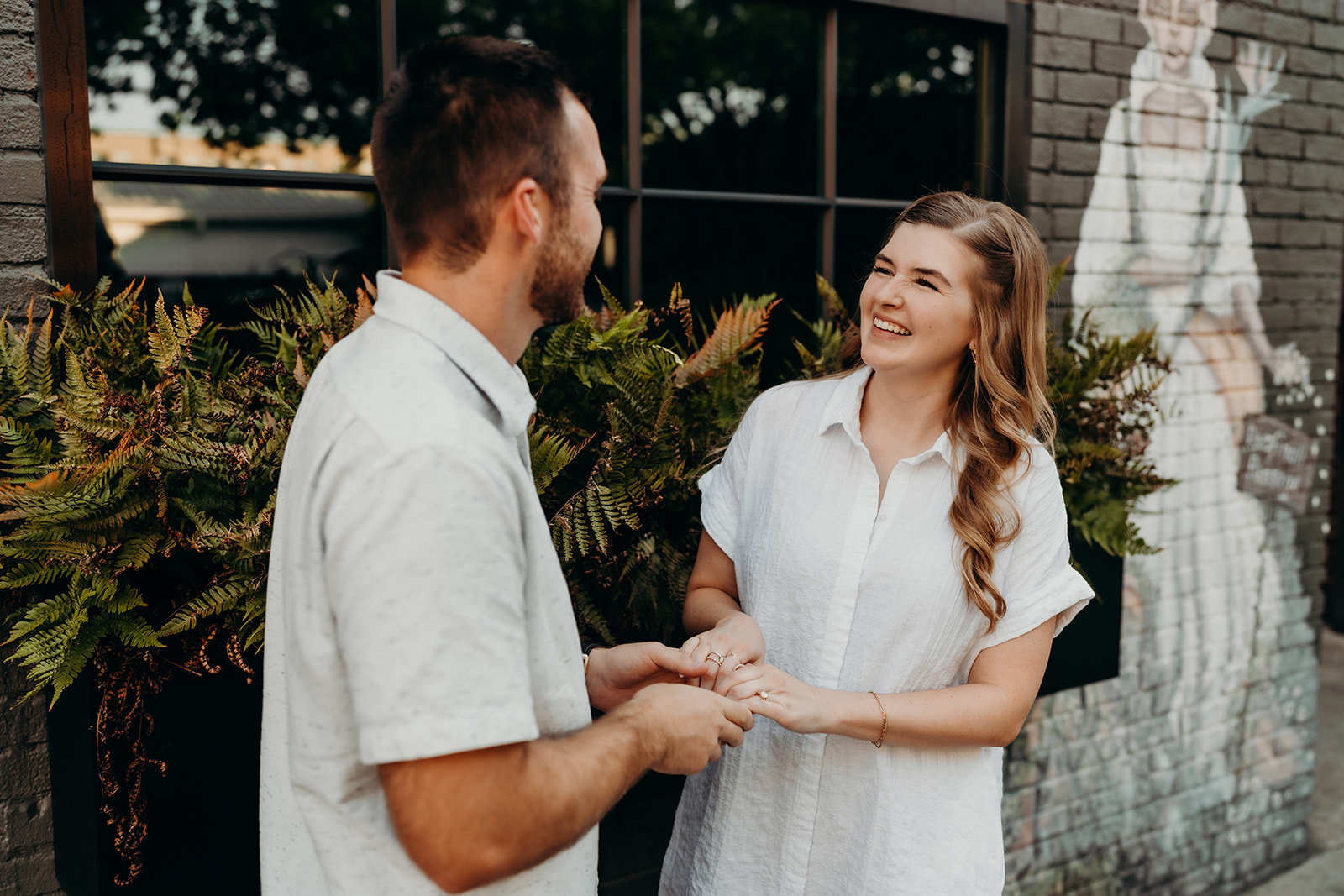 couple laughing together South End Charlotte Engagement