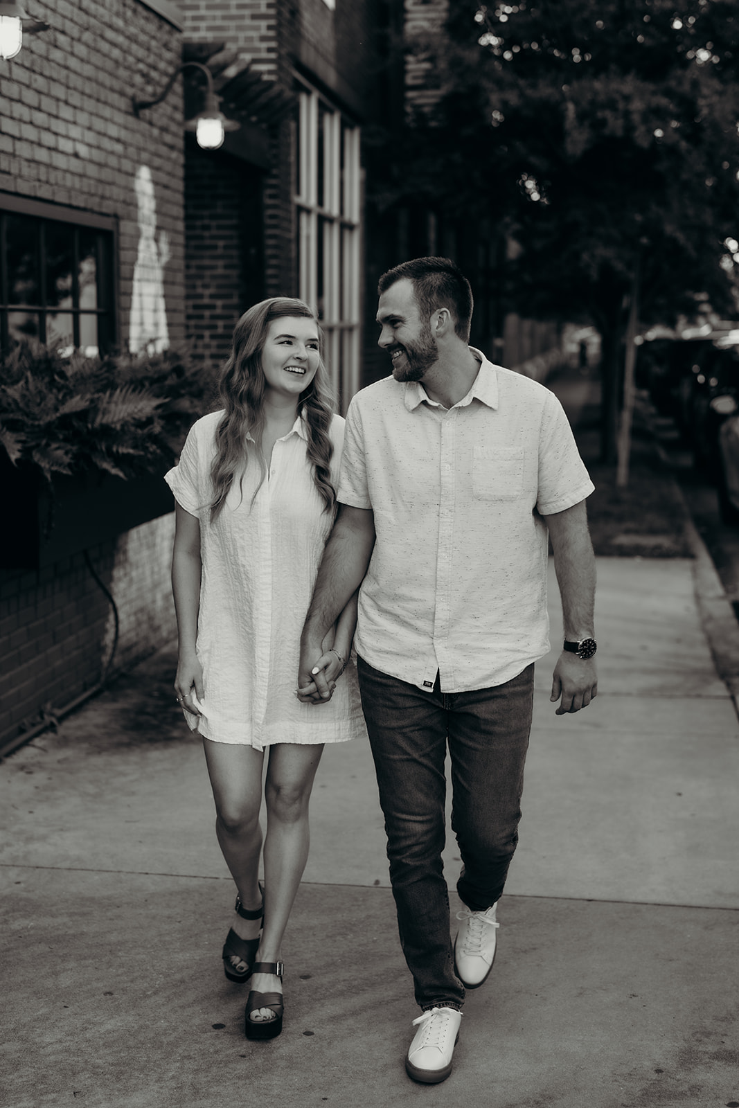 couple walking together South End Charlotte Engagement