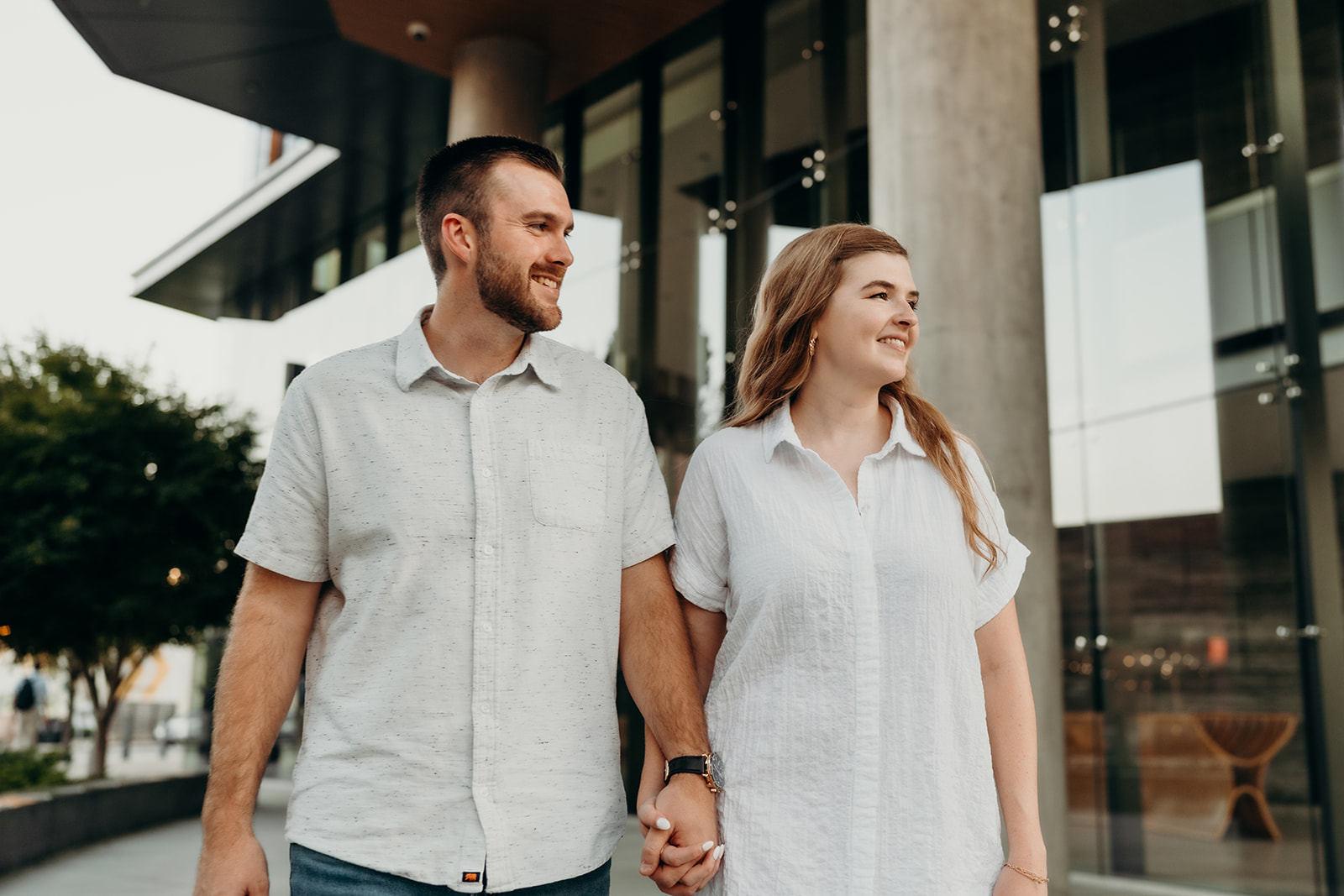 couple walking South End Charlotte Engagement
