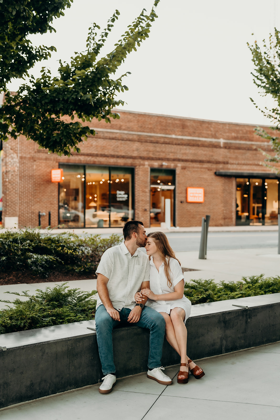 couple sitting South End Charlotte Engagement