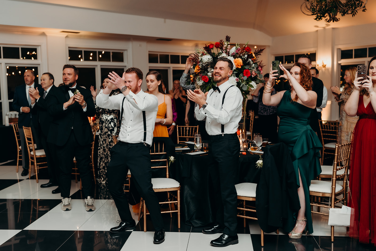 Guests in reception space cheering