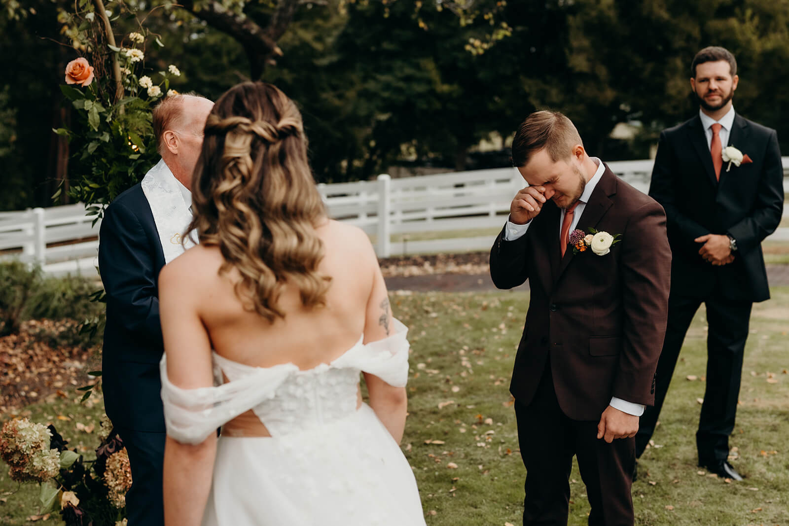 groom crying as he sees his bride for the first time during the wedding ceremony