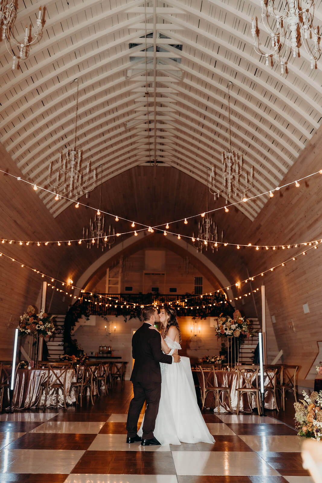 bride and groom sharing a private last dance at the end of the night at bride and groom portraits at The Historic Wakefield Barn