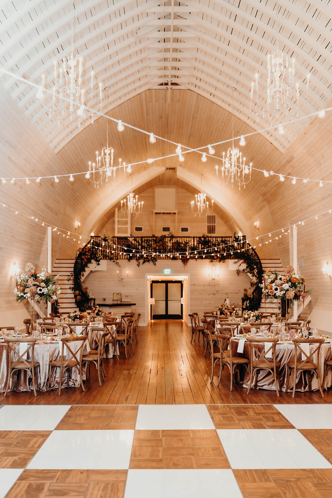 venue detail photo with checkered dance floor at bride and groom portraits at The Historic Wakefield Barn