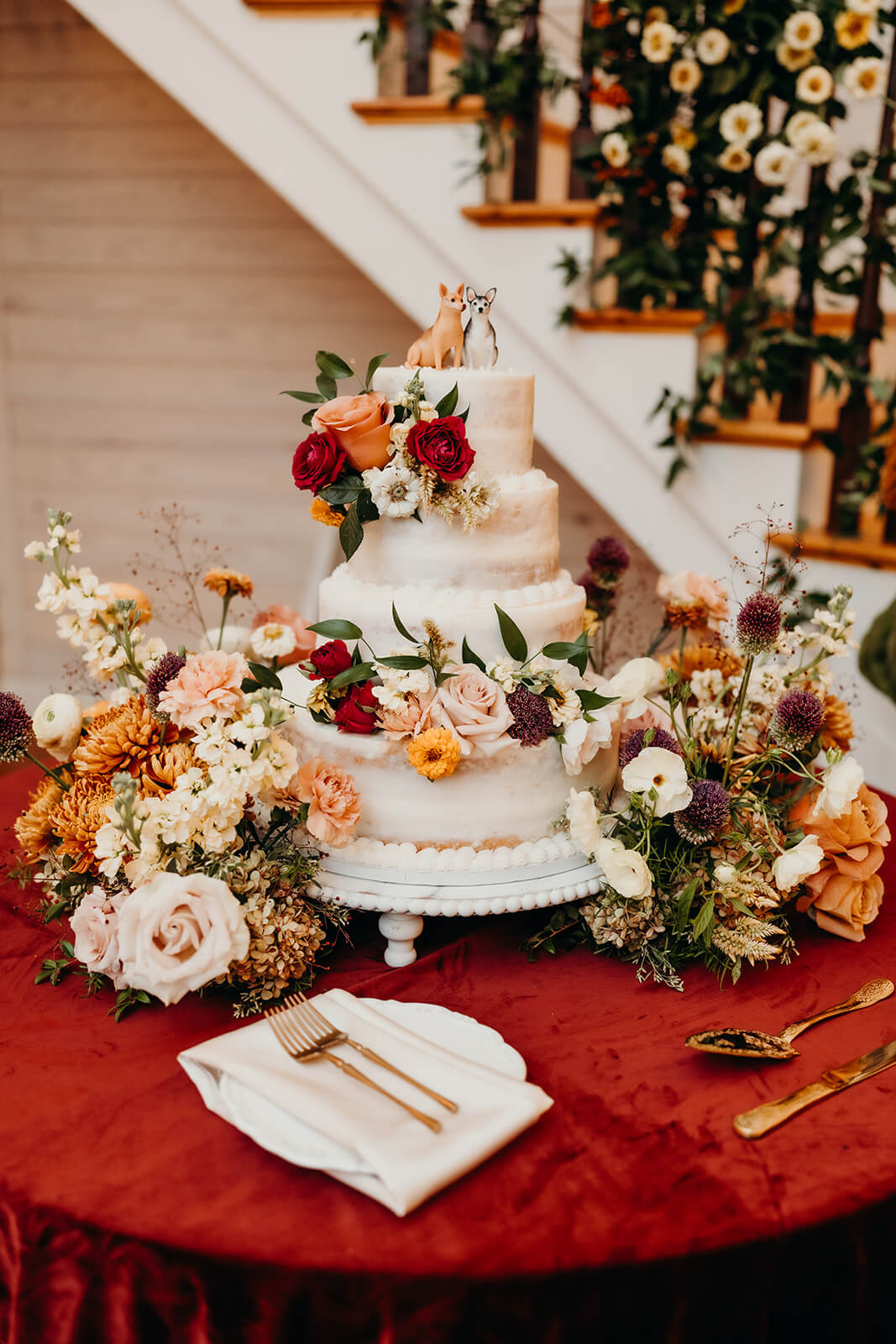 Wedding cake setup at bride and groom portraits at The Historic Wakefield Barn
