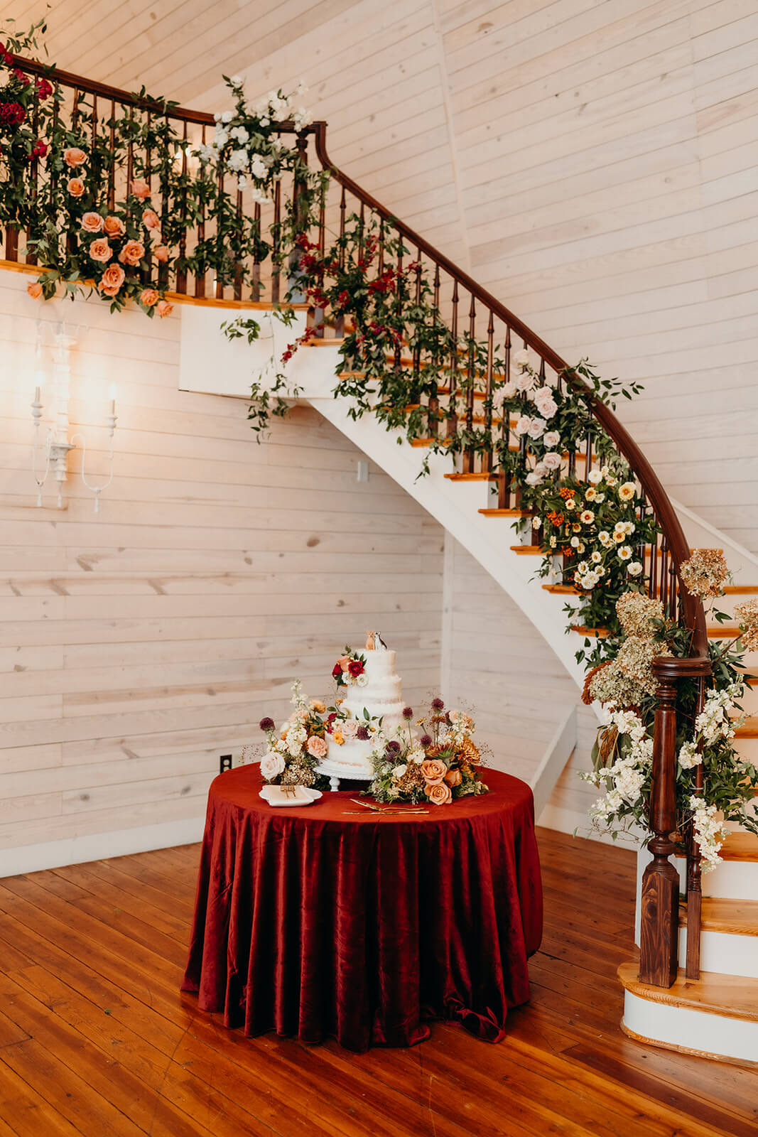 wedding cake set up at bride and groom portraits at The Historic Wakefield Barn