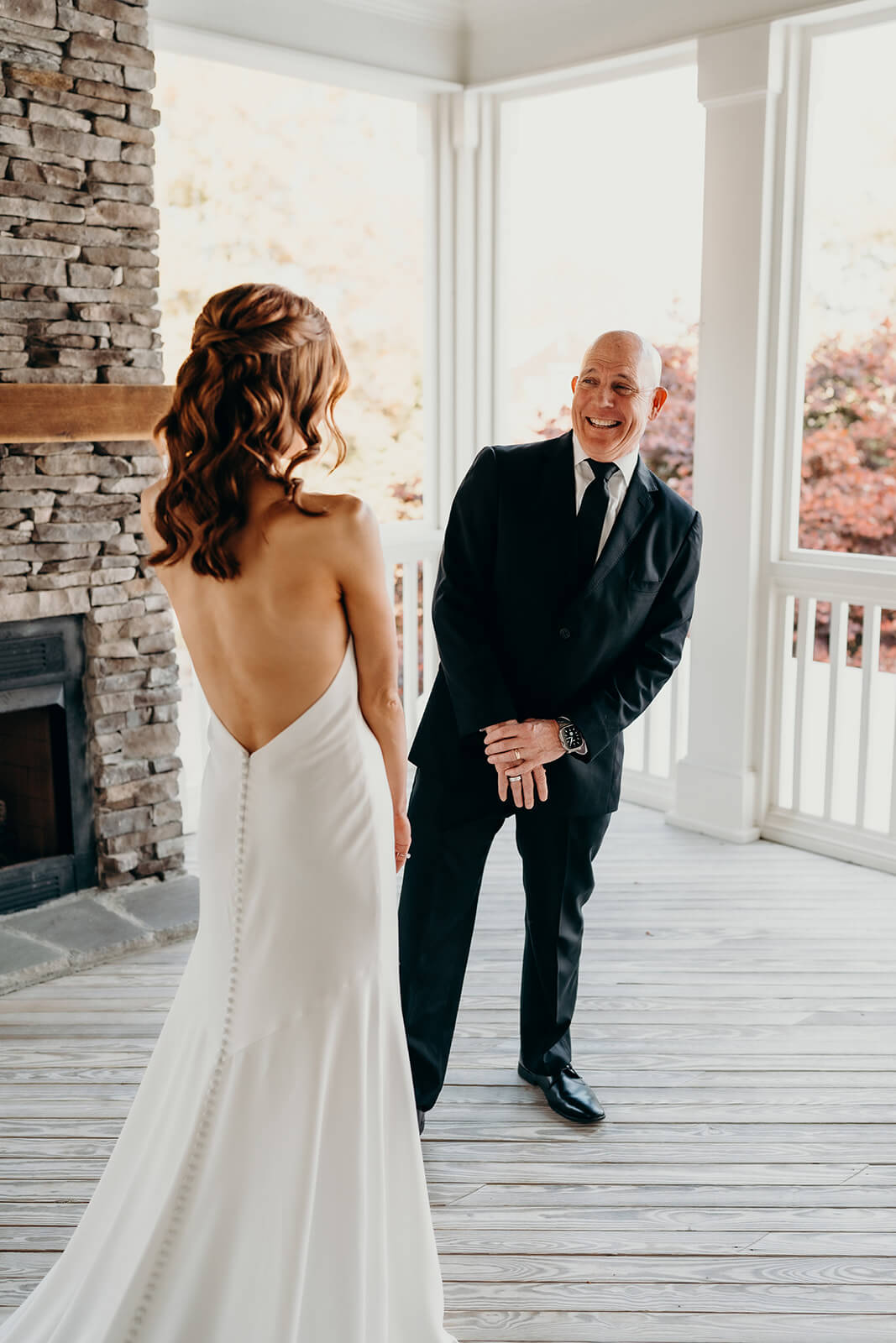 bride and dad first look moment on the porch at The Oaks at Salem