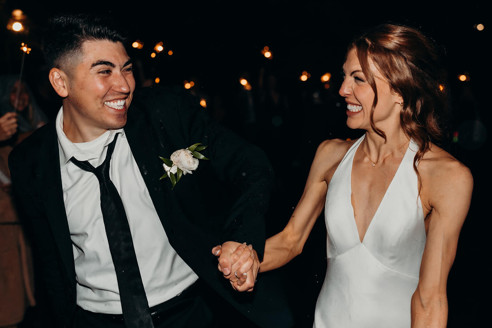 bride and groom exiting their reception
