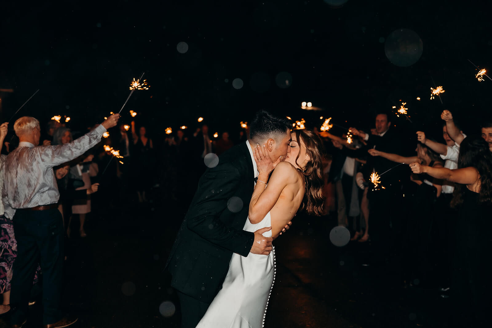 bride and groom exiting their reception
