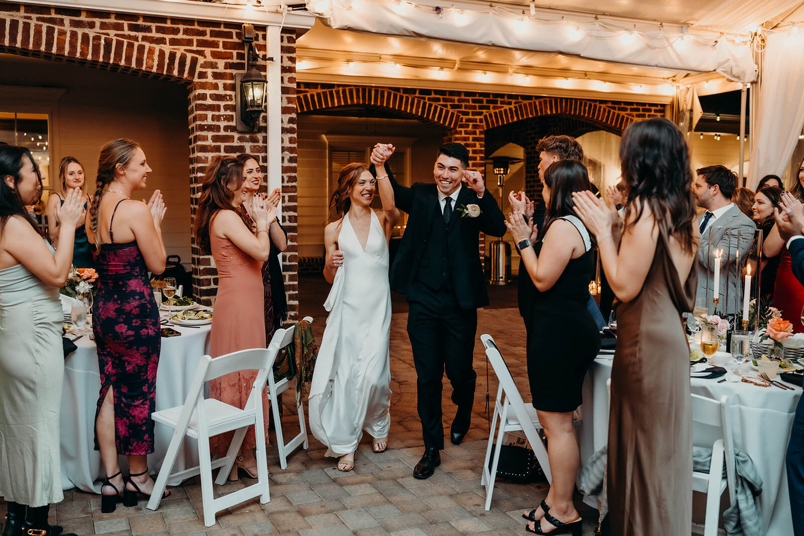 Bride and groom entering their reception at The Oaks at Salem