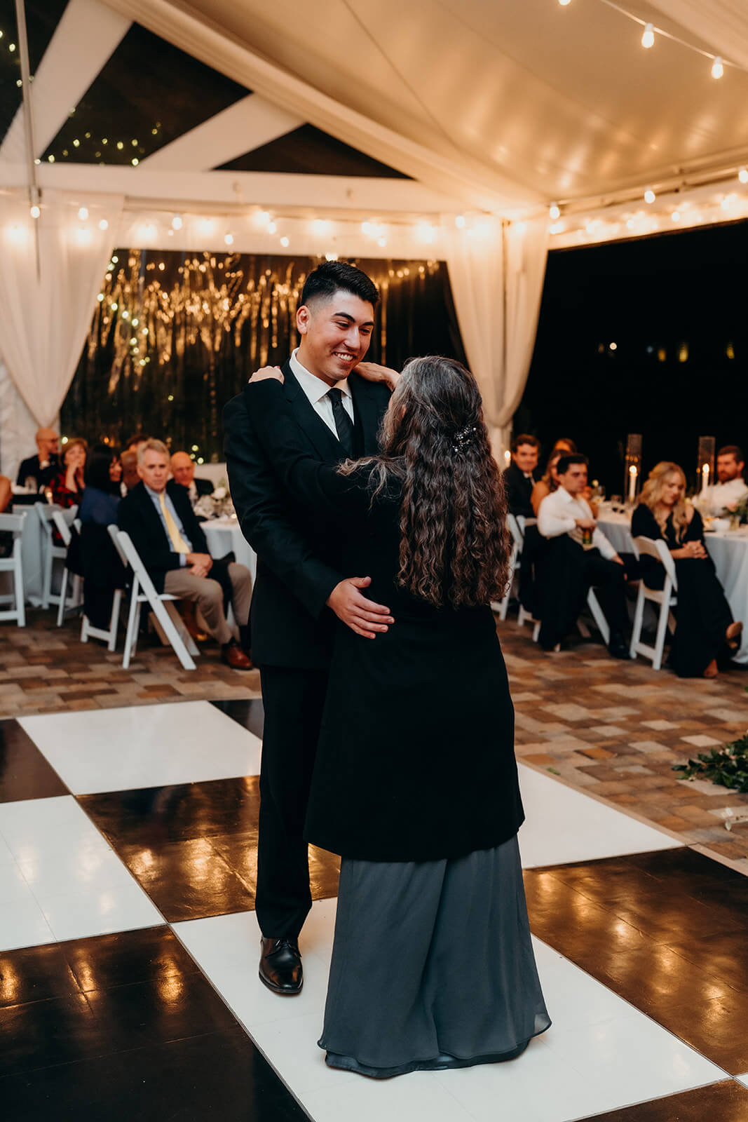 groom and his mom dancing