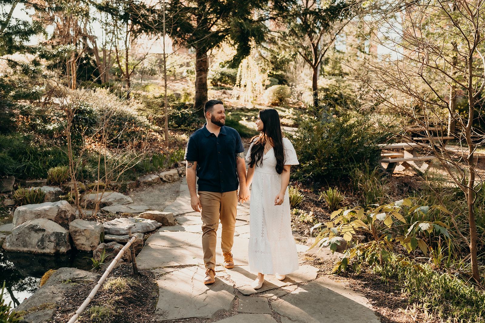 couple walking on stone path