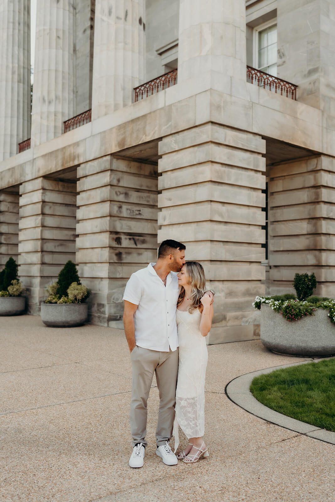 couple walking in front of the capitol building