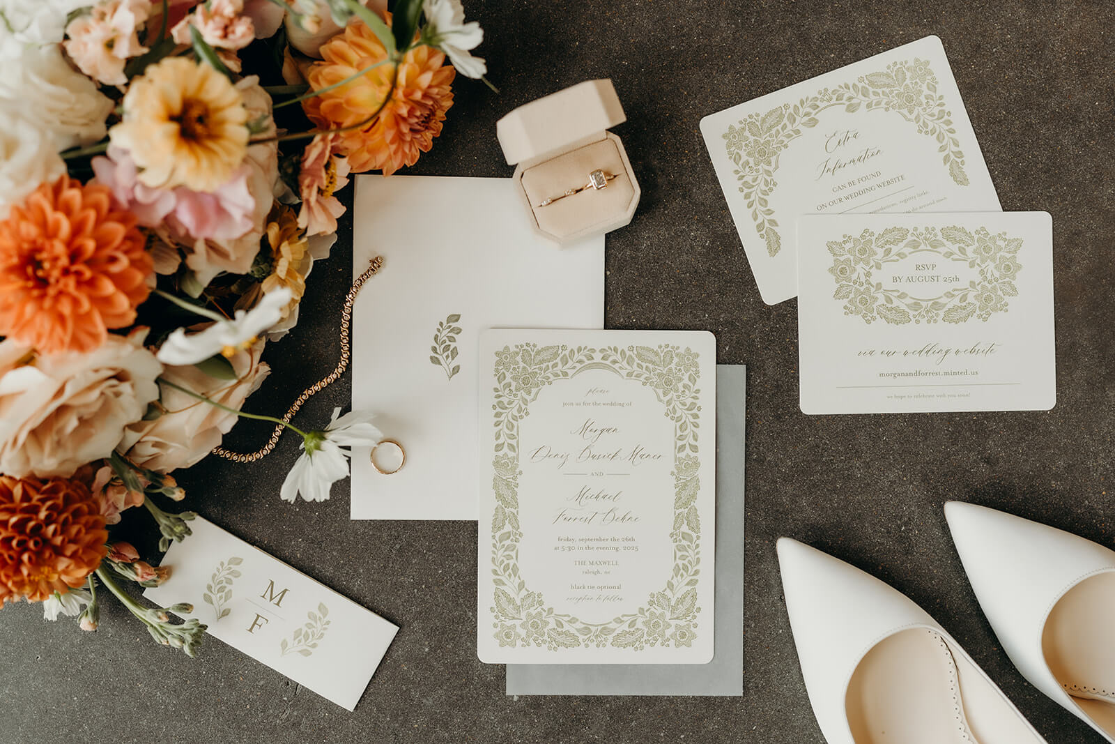 detail photo of the invitations and bride's accessories