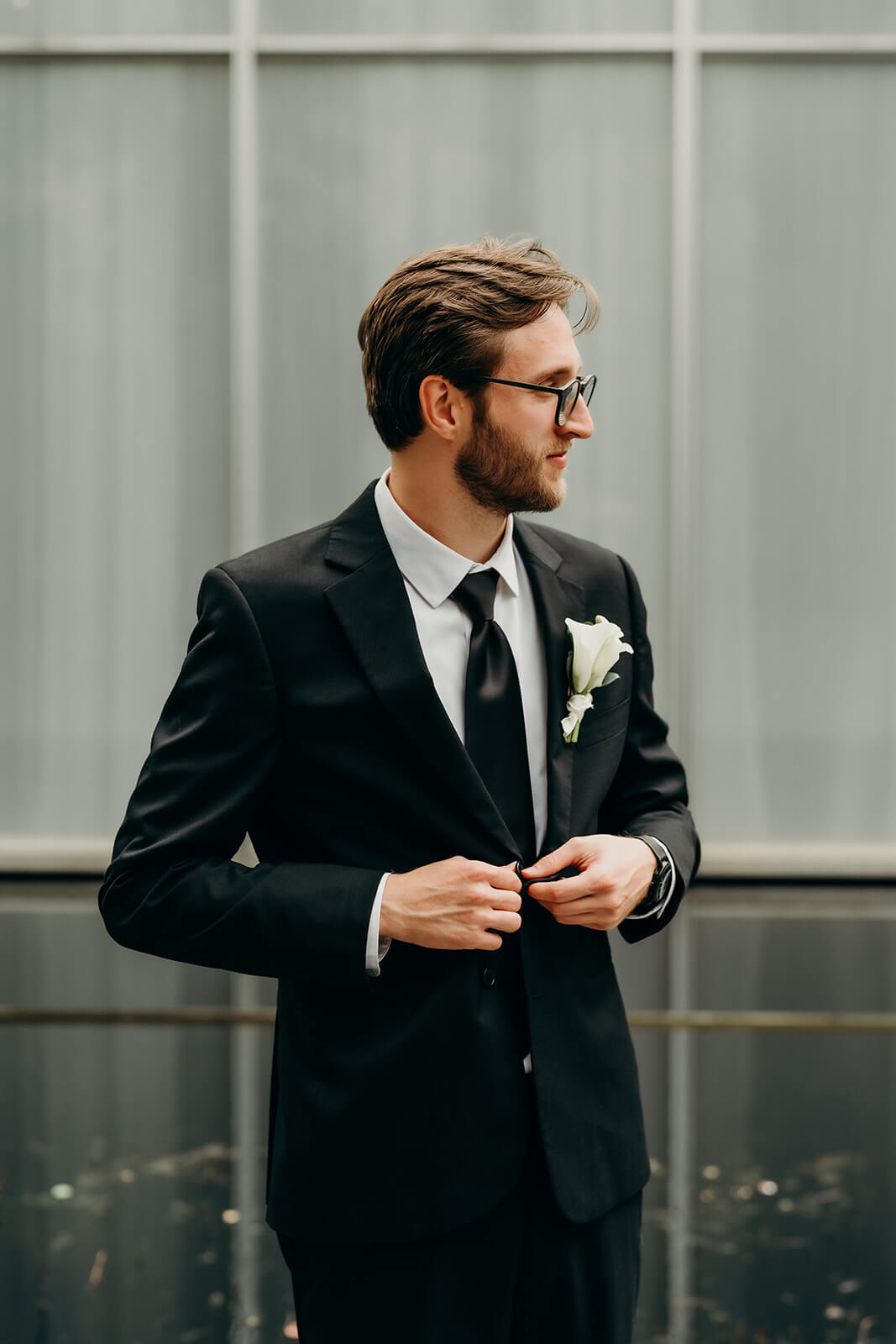 Groom getting ready outdoors during NCMA Wedding Photos