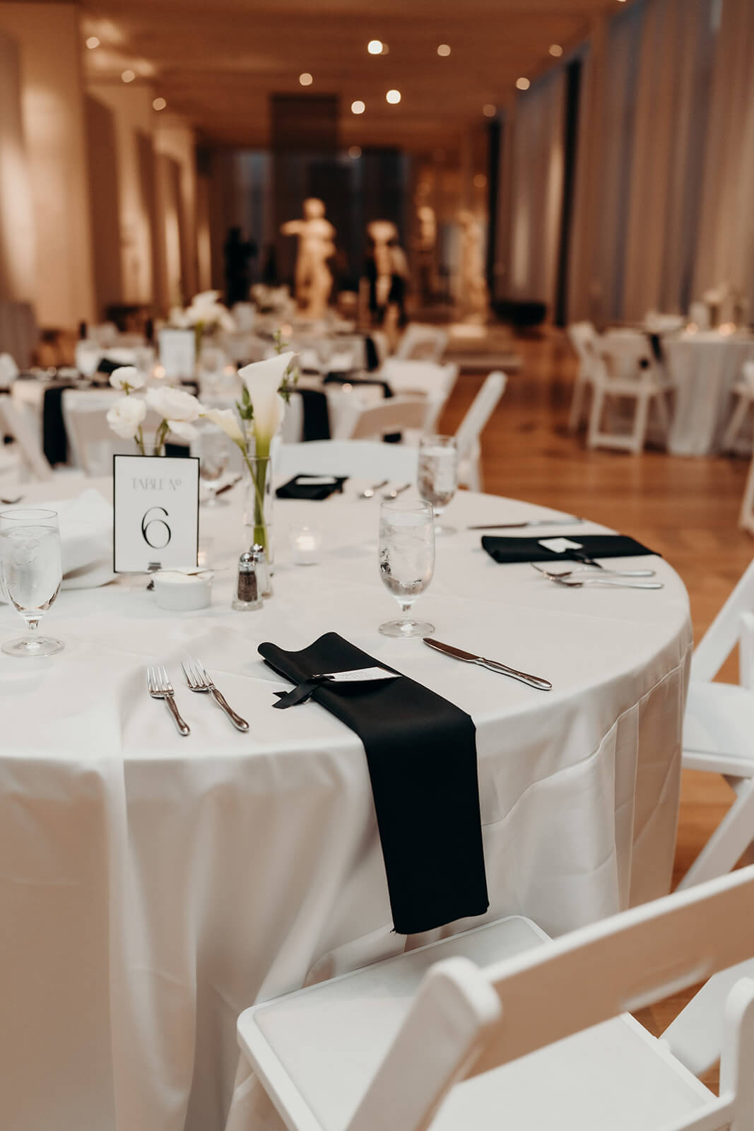 NCMA Wedding Photos reception details of tables and white and black theme decor