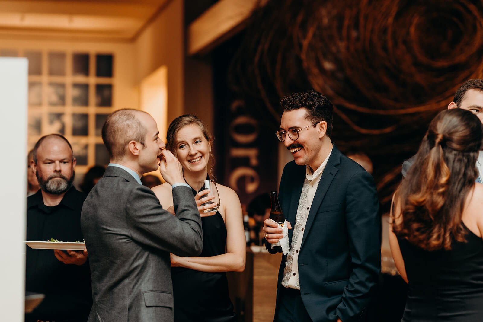 cocktail hour with guests laughing together
