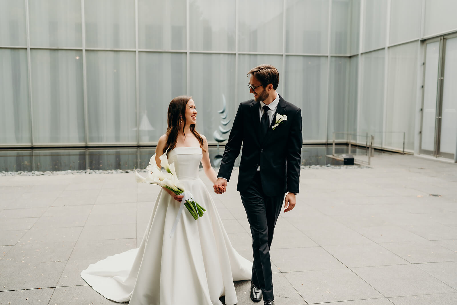 bride and groom first look moment outside of NCMA Wedding Photos