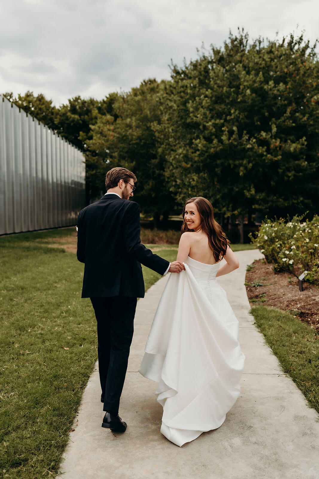 bride and groom first look moment outside of NCMA Wedding Photos